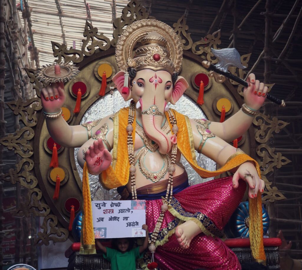 Ganesh Chaturthi Vibrant statue of Lord Ganesha at a festival parade, showcasing cultural traditions and artistry.